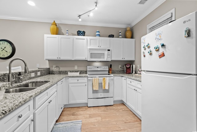 kitchen with sink, white appliances, white cabinetry, ornamental molding, and light wood-type flooring