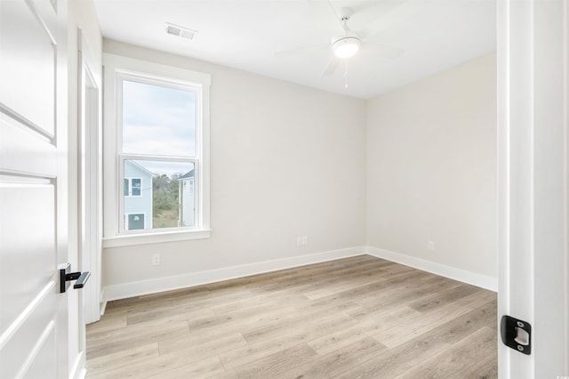 spare room featuring ceiling fan and light hardwood / wood-style floors