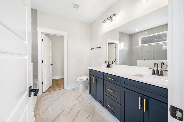 bathroom with vanity and toilet