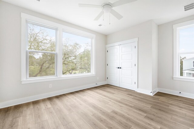 unfurnished room featuring ceiling fan and light hardwood / wood-style floors