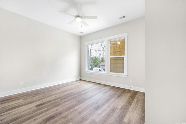 unfurnished room featuring ceiling fan and light hardwood / wood-style floors