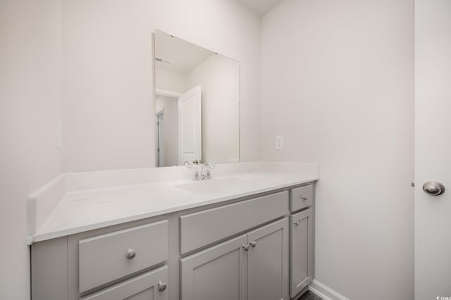 bathroom featuring vanity and visible vents