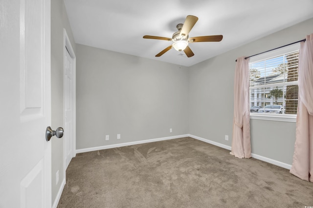 unfurnished bedroom featuring ceiling fan, baseboards, and light colored carpet