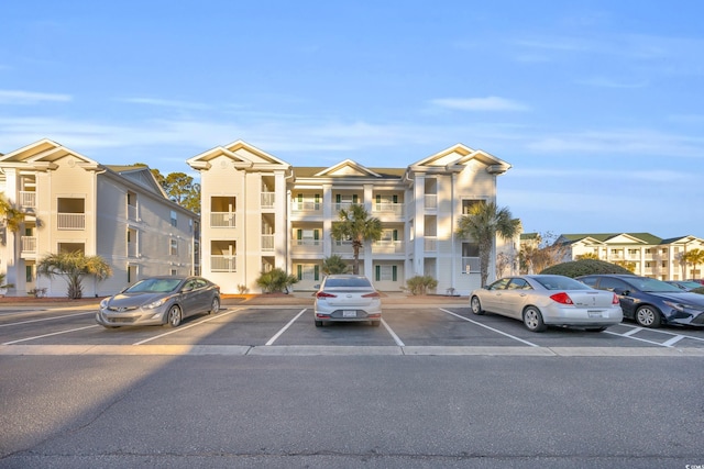 view of property with uncovered parking