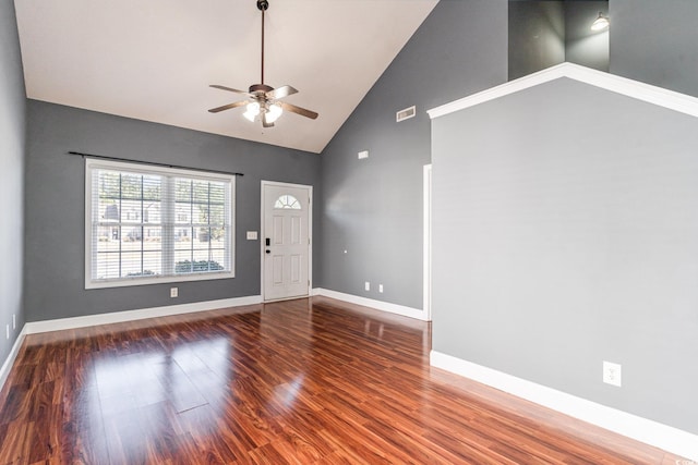 entrance foyer with ceiling fan, dark wood-type flooring, and high vaulted ceiling