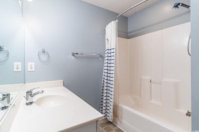 bathroom featuring shower / tub combo with curtain, vanity, tile patterned floors, and a textured ceiling