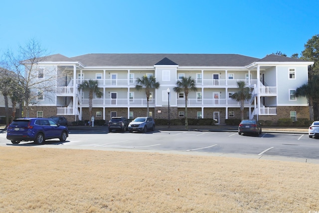 view of property with uncovered parking