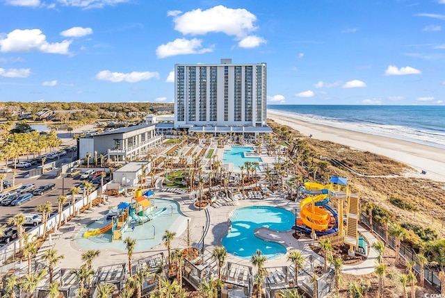 bird's eye view featuring a water view and a view of the beach