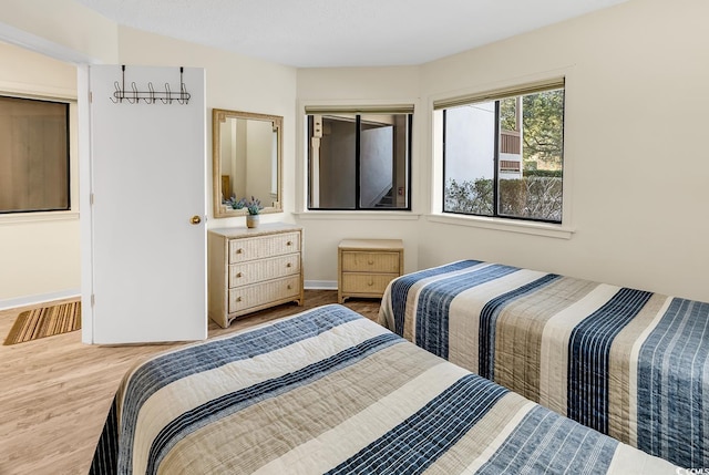 bedroom with wood-type flooring