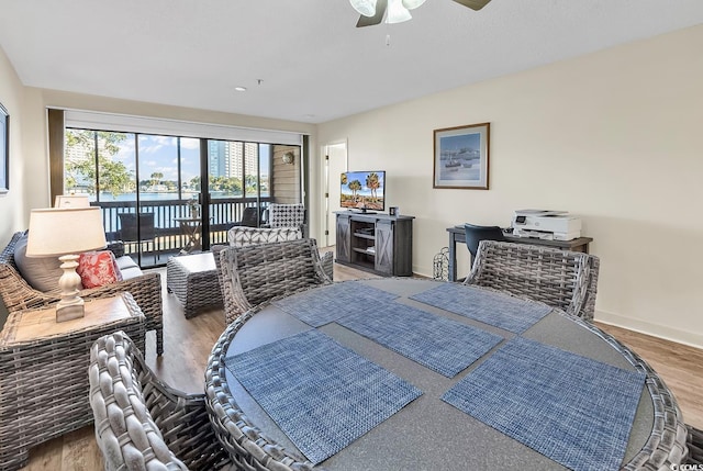 bedroom featuring hardwood / wood-style flooring, access to outside, and ceiling fan