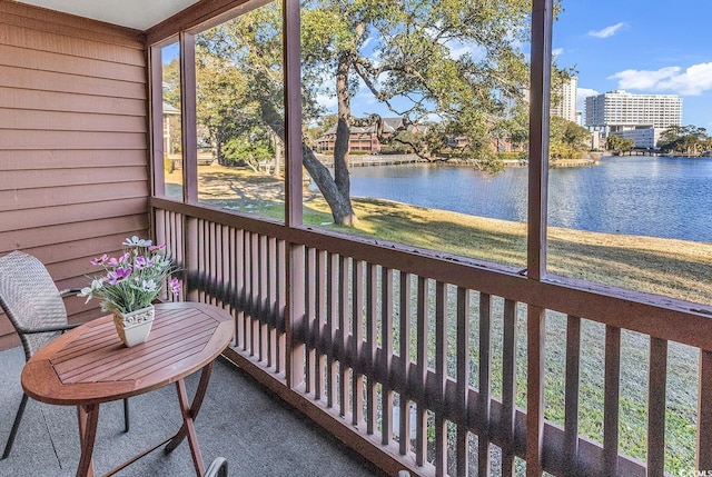 sunroom with a water view