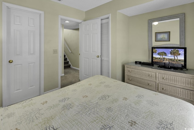 carpeted bedroom with a closet