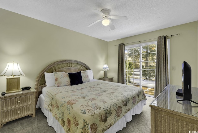 carpeted bedroom featuring ceiling fan, access to exterior, and a textured ceiling