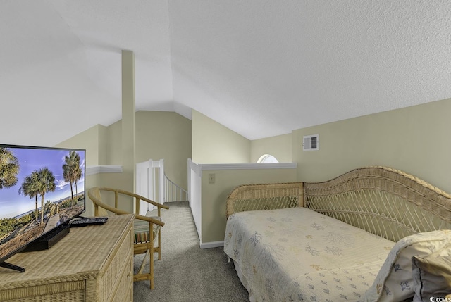 bedroom with multiple windows, light colored carpet, lofted ceiling, and a textured ceiling