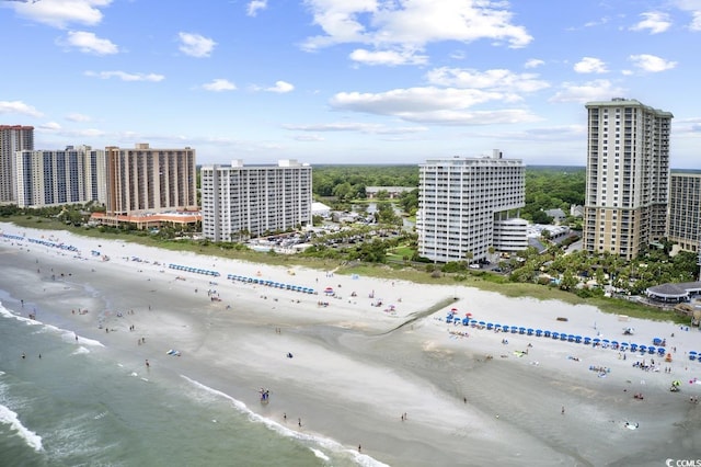 bird's eye view with a water view and a view of the beach