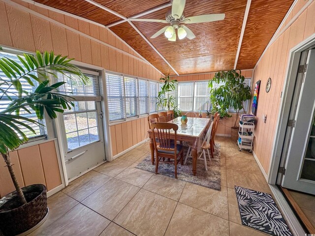 sunroom featuring lofted ceiling, wooden ceiling, and ceiling fan