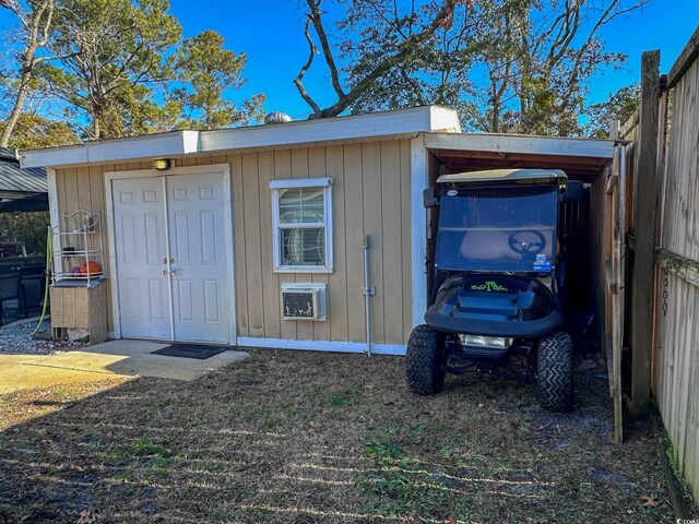 view of outbuilding with a carport