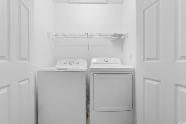 laundry room with washing machine and dryer