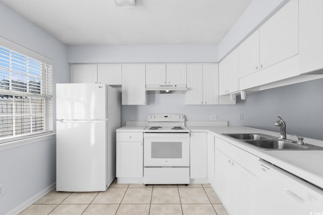 kitchen featuring white cabinetry, sink, white appliances, and light tile patterned floors