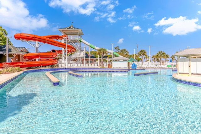 view of swimming pool featuring a water slide