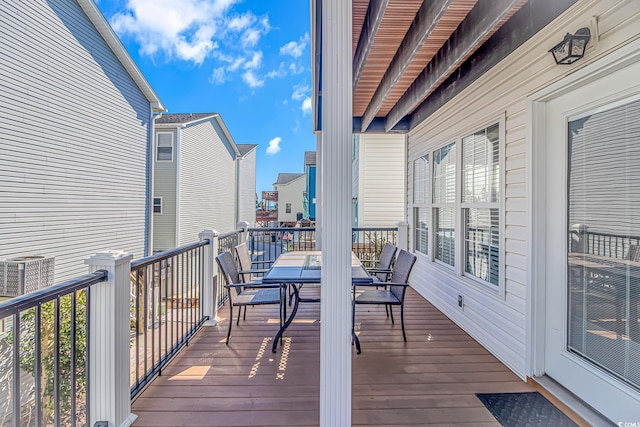 wooden deck with central air condition unit