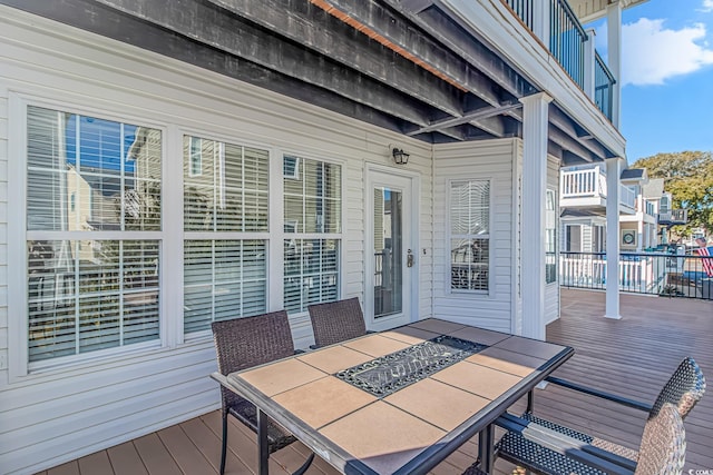 wooden deck with a fire pit