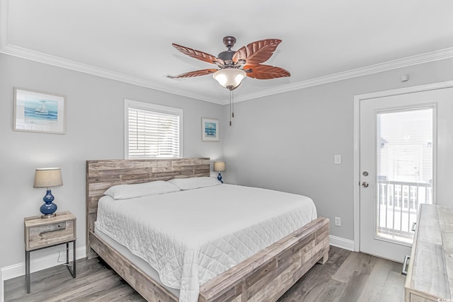 bedroom featuring hardwood / wood-style flooring, crown molding, and ceiling fan