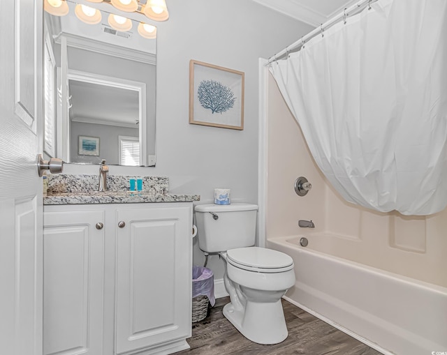 full bathroom with shower / tub combo, vanity, wood-type flooring, ornamental molding, and toilet