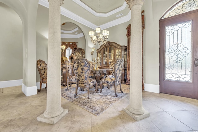 dining space with ornate columns, ornamental molding, and a healthy amount of sunlight