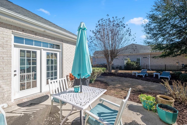 view of patio / terrace with outdoor dining space and fence
