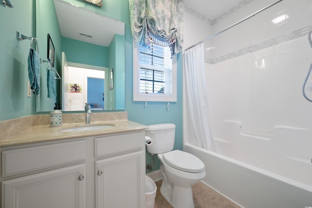bathroom with vanity, tile patterned floors, toilet, visible vents, and shower / bath combo with shower curtain