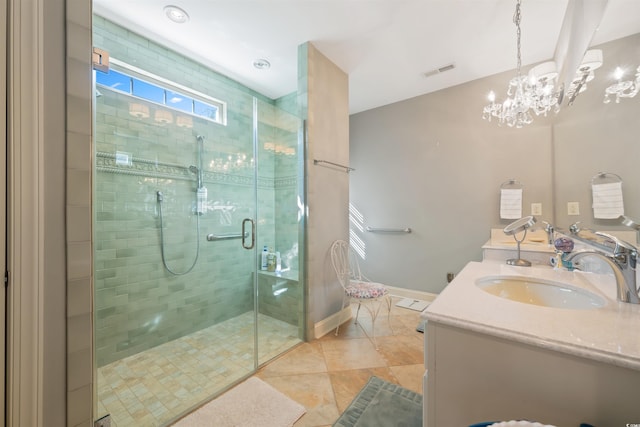 full bathroom with visible vents, a sink, a stall shower, double vanity, and a notable chandelier