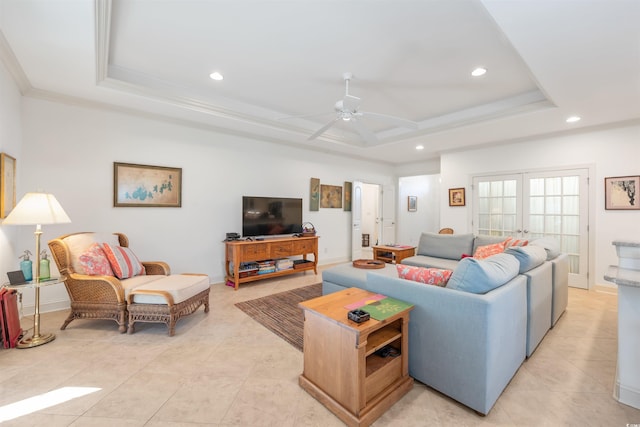 living area featuring ceiling fan, a raised ceiling, light tile patterned flooring, and recessed lighting