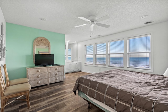 2022 N Waccamaw Dr, Garden City Beach, SC 29576 - bedroom featuring a textured ceiling, wood finished floors, and ceiling fan