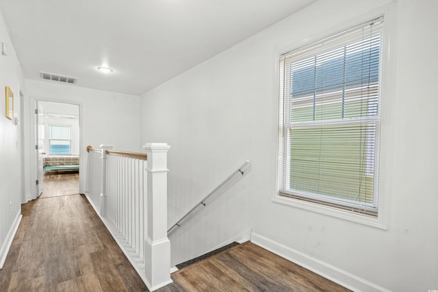 2022 N Waccamaw Dr, Garden City Beach, SC 29576 - hall with an upstairs landing, dark wood-style floors, and baseboards