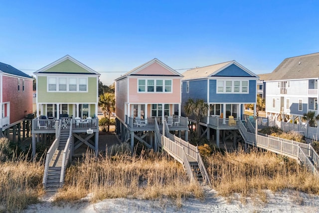 2022 N Waccamaw Dr, Garden City Beach, SC 29576 - rear view of house with stairway