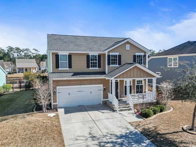 view of front property featuring a garage, covered porch, and a front lawn