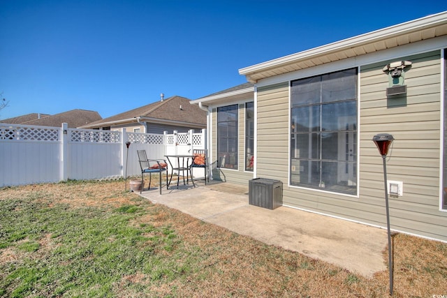 view of yard featuring fence and a patio