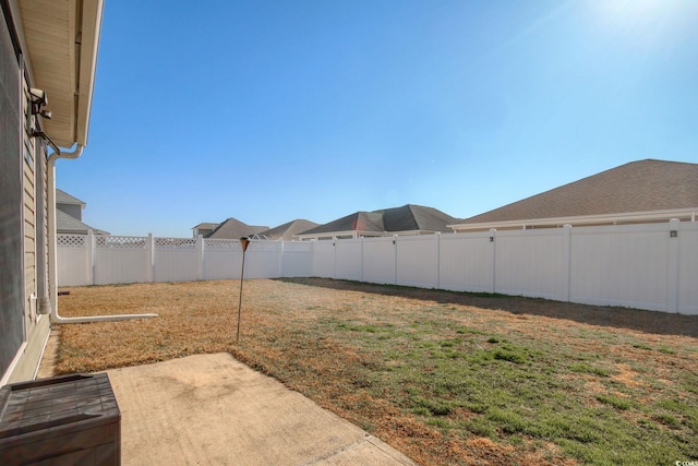 view of yard featuring a patio area and a fenced backyard