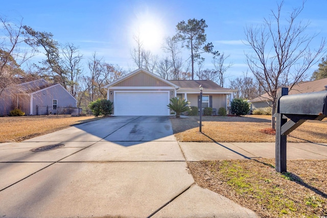 view of front of home with a garage and driveway