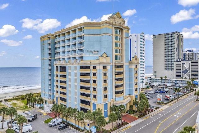 view of property featuring a water view and a view of the beach