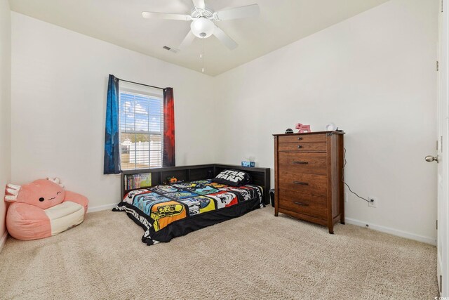 office space featuring light carpet and ceiling fan