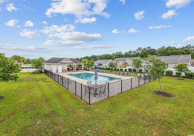 view of swimming pool with a lawn and a patio area