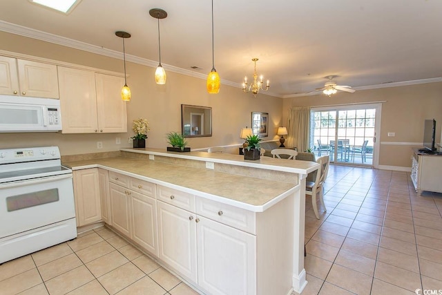 kitchen featuring light tile patterned floors, white appliances, and kitchen peninsula