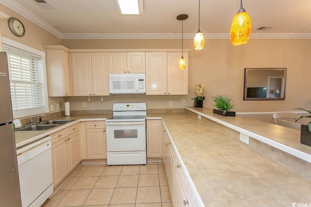 kitchen with hanging light fixtures, ornamental molding, sink, and white appliances