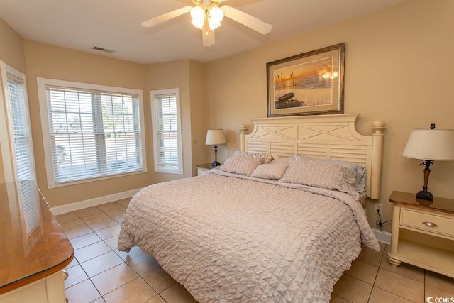 bedroom with light tile patterned floors and ceiling fan