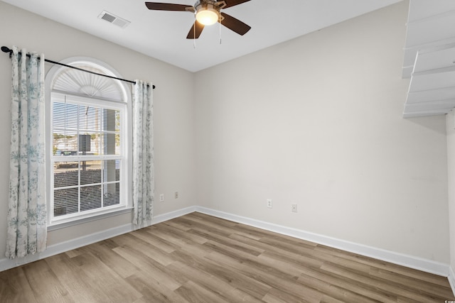 empty room featuring light hardwood / wood-style floors and ceiling fan