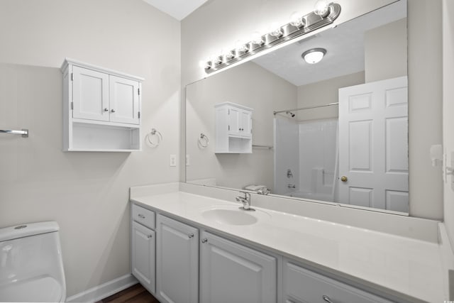 full bathroom with vanity, shower / bathtub combination, and toilet