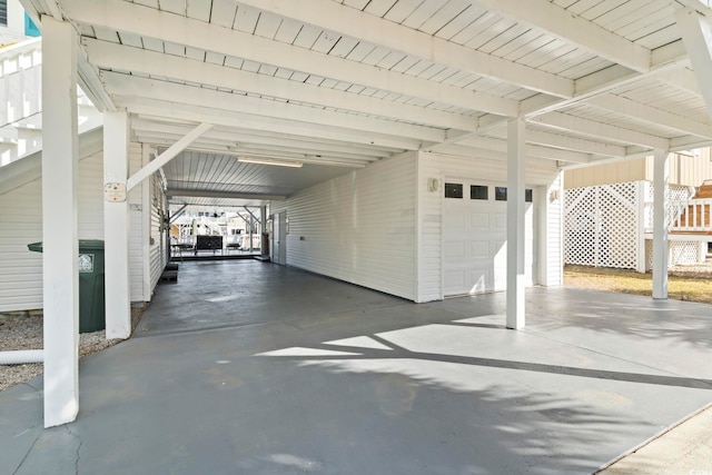 garage featuring a carport