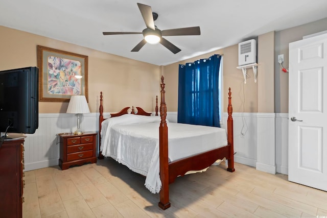 bedroom with ceiling fan and light hardwood / wood-style flooring